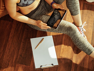 woman playing at her tablet gadget